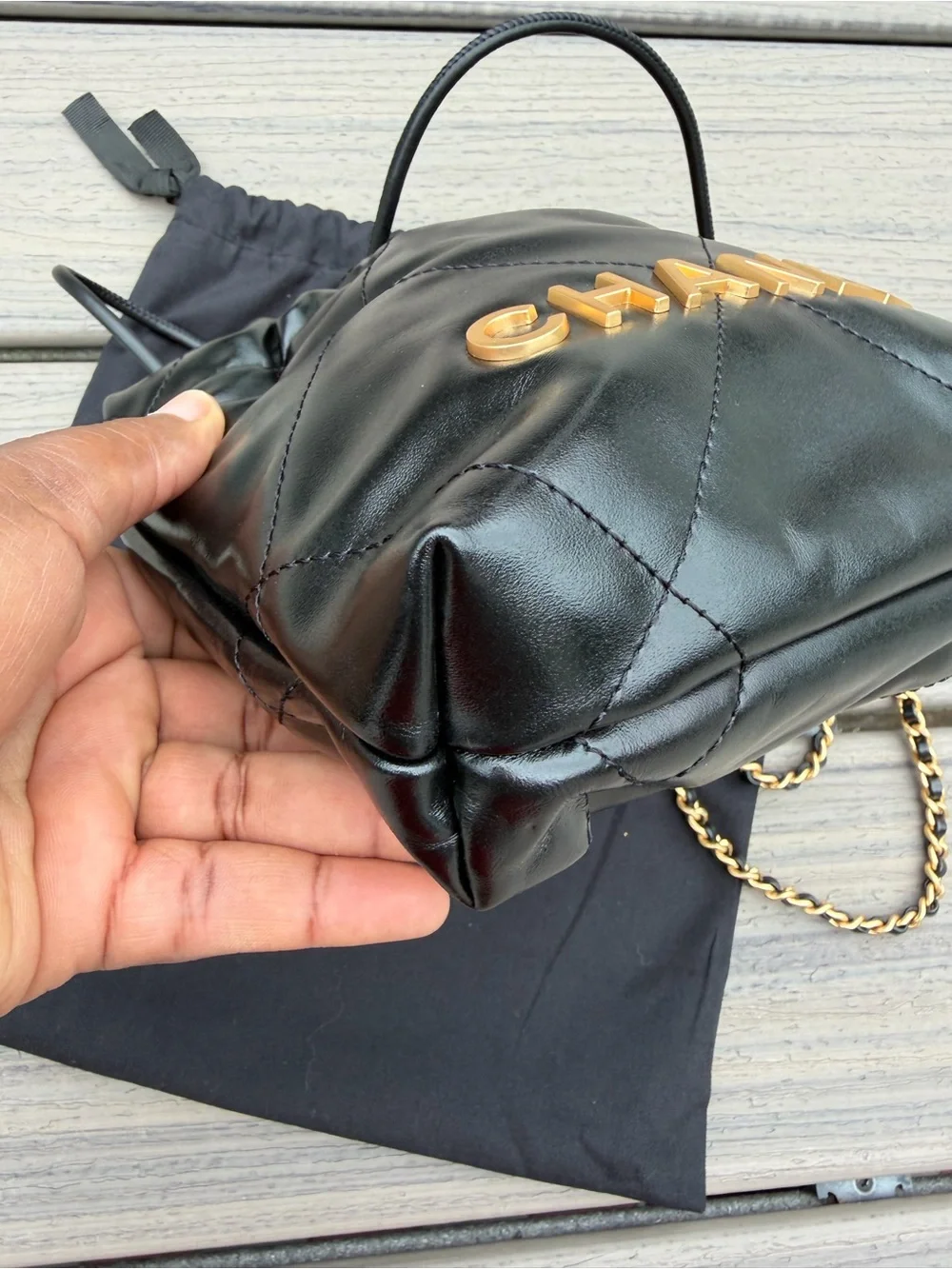 CHANEL Black Quilted Leather Drawstring Crossbody with Gold Chain